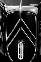 Conceptual black and white image of the front of a classic car