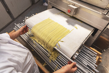 Pasta through a roller machine