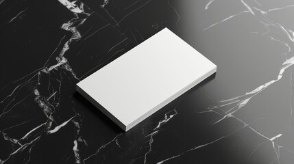 A white card is on a black marble countertop