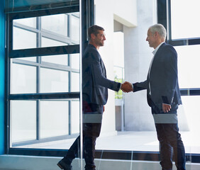 Business men, handshake and networking in office with agreement, deal or partnership. Greeting,...