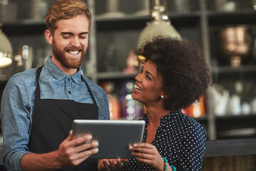 Waiter, man and woman with tablet in cafe with discussion, choice and planning menu on app. People,...