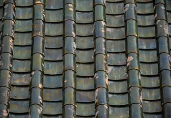 Roof tile seamless pattern for house covering in green,Close up Detail of Perfect roof green tiles texture,green roof background image,wide panorama of tile roof.