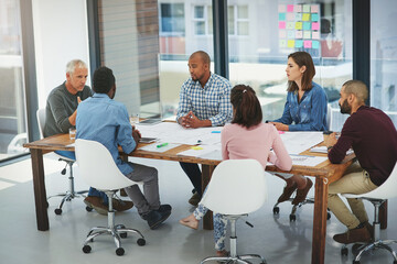 Business people, meeting and discussion with team for collaboration, creative planning or brainstorming at office. Group of employees talking in boardroom, conference or ideas in startup at workplace