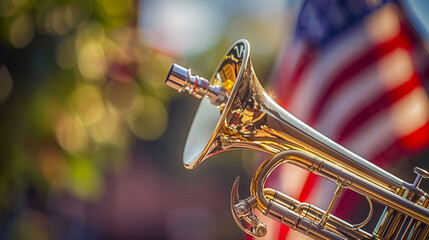 A close-up image of a brass military bugle used in a Memorial Day ceremony to play 'Taps' with a blurred American flag in the background.