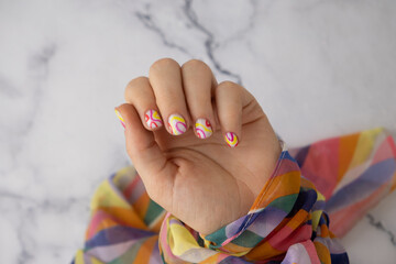 Woman manicured hands, stylish summer colorful nails. Closeup of manicured nails of female hand....