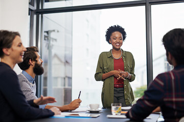 Black woman, coach and presentation with team for business discussion, planning or conference at...