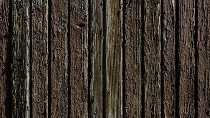  An old surface made of boards with peeling paint
