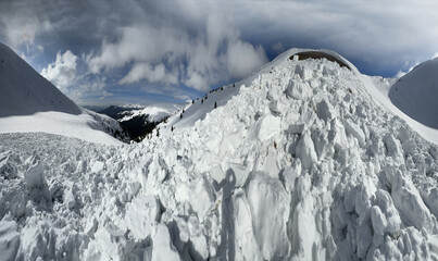 a powerful avalanche fell from an alpine slope in the Ukrainian Carpathians, huge blocks of snow...