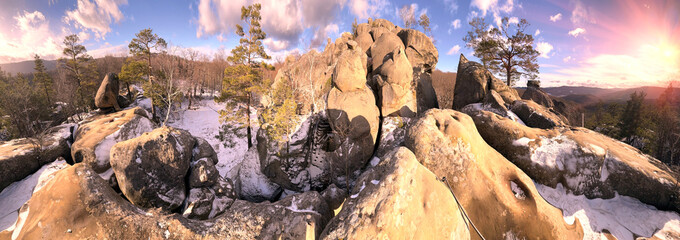 Dovbush rocks in winter in Bubnyshche, Carpathians, Ukraine, Europe. Huge stone giants rise in the snowy transparent beech forest, all-round panoramic views are unique without leaves