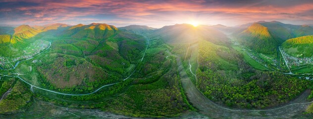drone flies over a spring Carpathian peak with an interesting phenomenon - the mountain forest on...