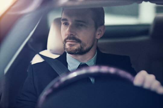 Businessman, thinking and driving in car for travel for commute to corporate work or job as entrepreneur of company. Man, motor vehicle and daily journey with transportation, traffic and on route.