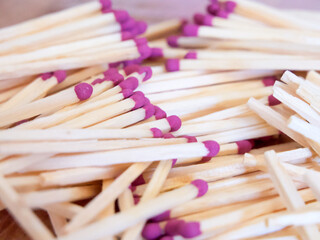 Colorful Matchstick Heads. A cluster of matchsticks with purple heads. Uses for Safety instructions, educational content.