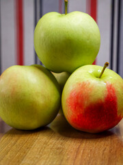 Organic Apples on Wood. A group of apples on a wooden backdrop, perfect for organic food marketing.