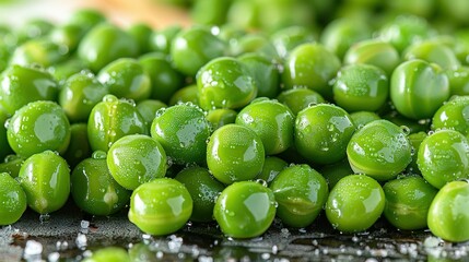   Green pea piles on a wet table