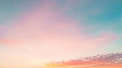 Pastel sunrise sky with gentle clouds.