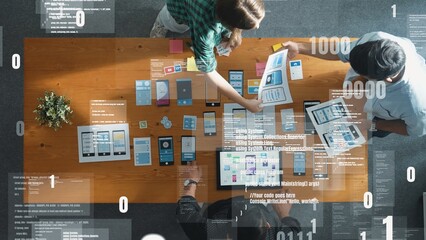 Top aerial view of smart business team working together to design Ux Ui designing. Group of diverse people brainstorming and discussing about coding engineering prompt and program system. Convocation.