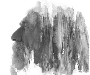 A desaturated paintography double exposure profile of an old bearded man