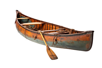 A wooden canoe with a paddle on it. The canoe is old and has a blue and green color