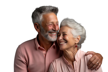 A man and a woman are smiling at the camera. They are both wearing pink shirts