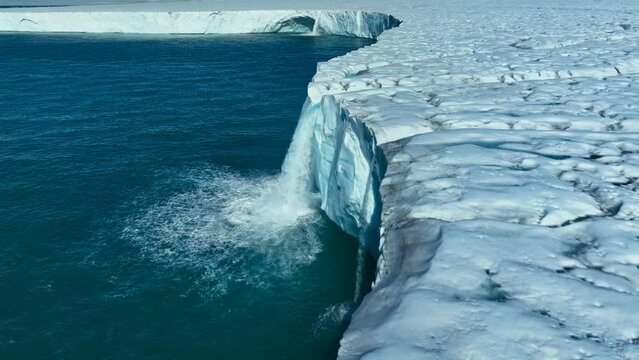 A moving image from above of the melting of the vast polar ice caps