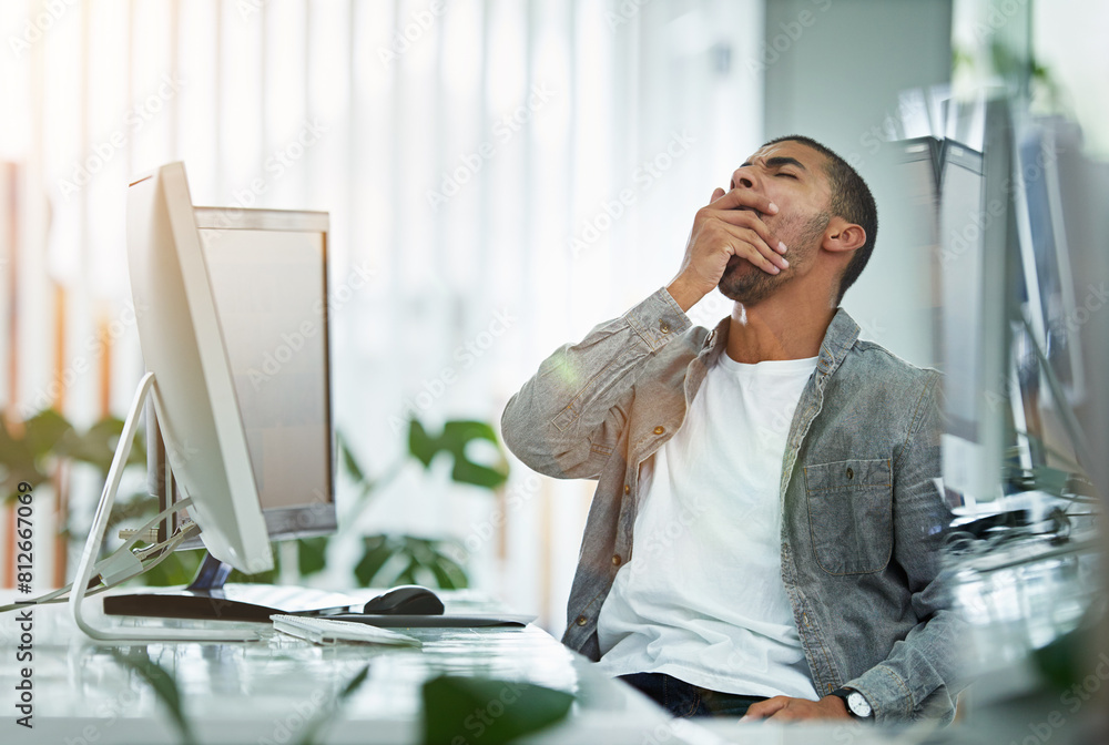 Poster Burnout, computer and yawn with designer man in office for creative project deadline or development. Fatigue, overworked and tired with design employee in workplace for late shift or overtime