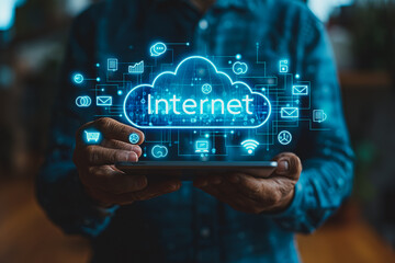 A man is holding a tablet with a blue cloud and the word Internet on it