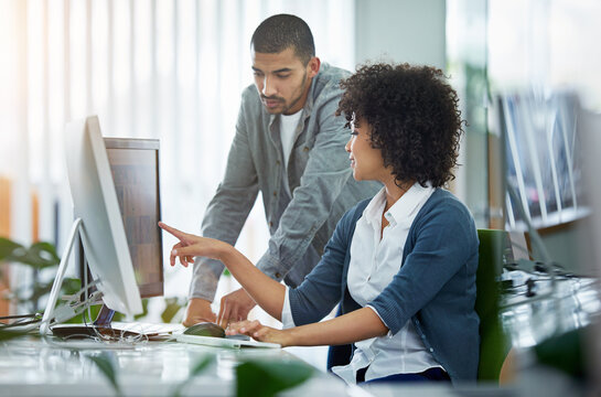 Business people, help and man with woman, pc and advice with internet, kpi review and planning. Progress, graphic designer and coworkers with computer, solution and coaching with mentor and training