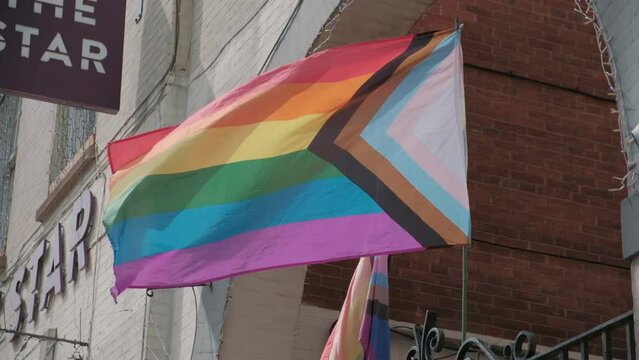 Rainbow flag, the gay pride flag, LGBTQ+  pride flag blowing in a breeze.