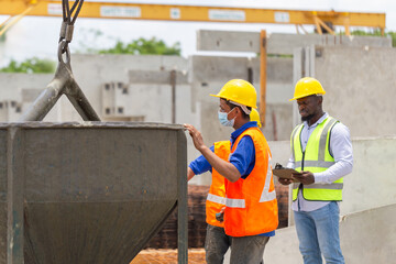 Engineer man and builders team in hardhats discussing on construction site, Foreman and worker...