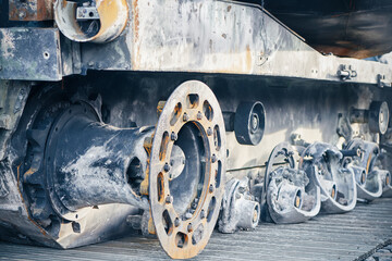 Damaged wheel tracks of destroyed and burned out tank on on the city street due to war of Russia...