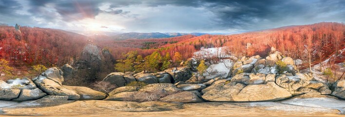 Dovbush rocks in winter in Bubnyshche, Carpathians, Ukraine, Europe. Huge stone giants rise in the snowy transparent beech forest, all-round panoramic views are unique without leaves