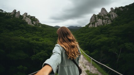 Woman hiking holding man's hand and leading him in outdoor nature.