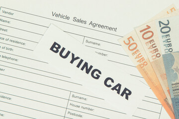 Form of vehicle sales agreement, inscription buying car and euro banknotes. Sales, buying car