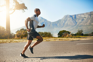Running, man and fitness for outdoor training, cardio workout or endurance challenge. Lens flare,...