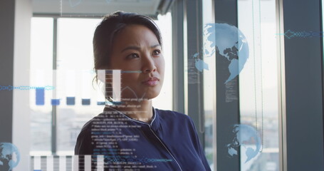 Image of graphs, globes and computer language over thoughtful asian woman in office