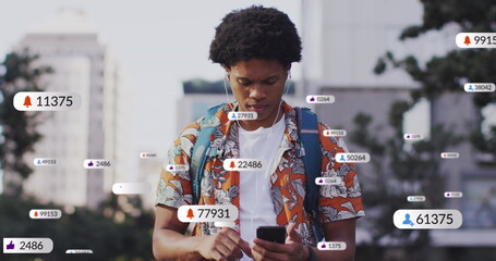 Image of social media data processing over african american man using smartphone in city