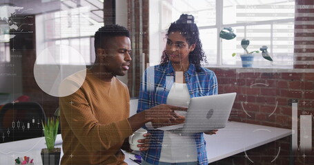 Image of statistical data processing over diverse man and woman discussing over laptop at office