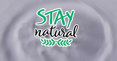 Image of stay natural text over water droplets on grey background