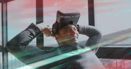 Image of scope scanning and data processing over man wearing vr headset