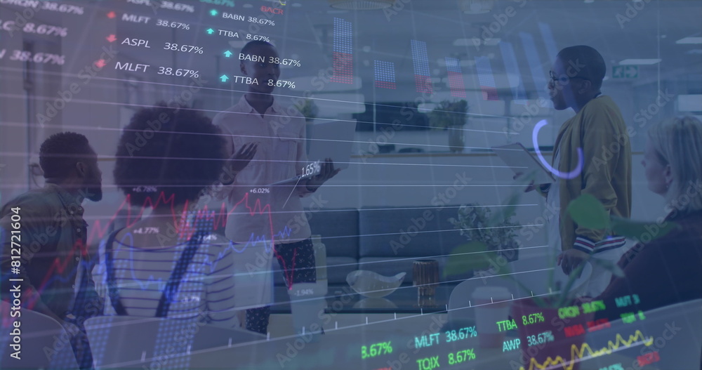 Wall mural Image of stock market data processing over diverse colleagues discussing together at office