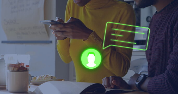 Image of neon profile and message icon against african american woman taking a picture at a cafe