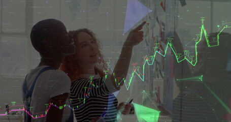 Image of illuminated connected dots and diverse female colleague brainstorming over sticky notes