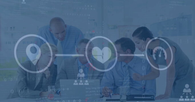 Image of flowchart of icons over diverse coworkers discussing reports on laptop in office