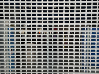 Grey metal mesh curtain door entrance to the store.