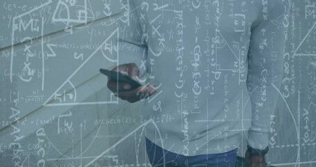 Image of mathematical data processing over african american businessman using smartphone