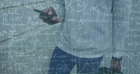Image of mathematical data processing over african american businessman using smartphone