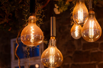 light bulbs in a nostalgic design glow against a rustic background