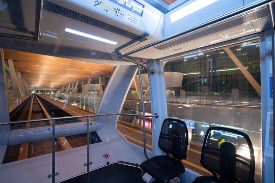 DOHA, QATAR - OCTOBER 13, 2023: interior shot of Hamad International Airport glass-roofed passenger train.