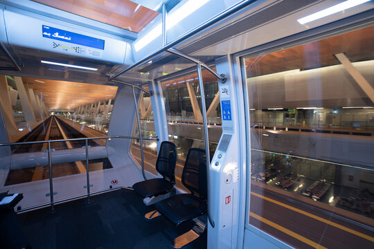 DOHA, QATAR - OCTOBER 13, 2023: interior shot of Hamad International Airport glass-roofed passenger train.