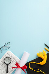 E-learning accomplishment motif. Flat lay vertical top view composition featuring keyboard, cap,...